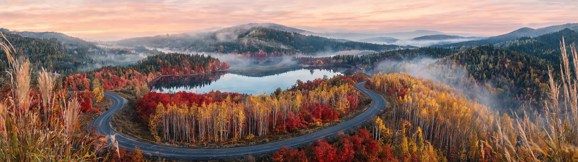 Autumn Road Through Misty Valley